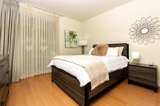 a bedroom with a bed and two night stands